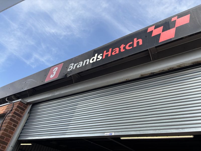 The Brands Hatch sign above the pit garage door