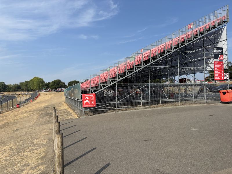 The Brands Hatch grandstand under a blue sky