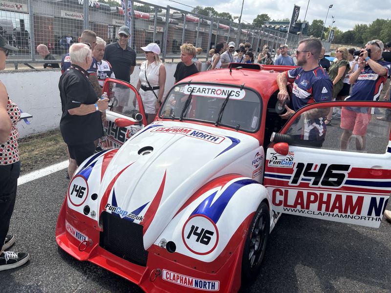 Car 146 in Clapham North livery on the Brands Hatch grid, surrounded by guests