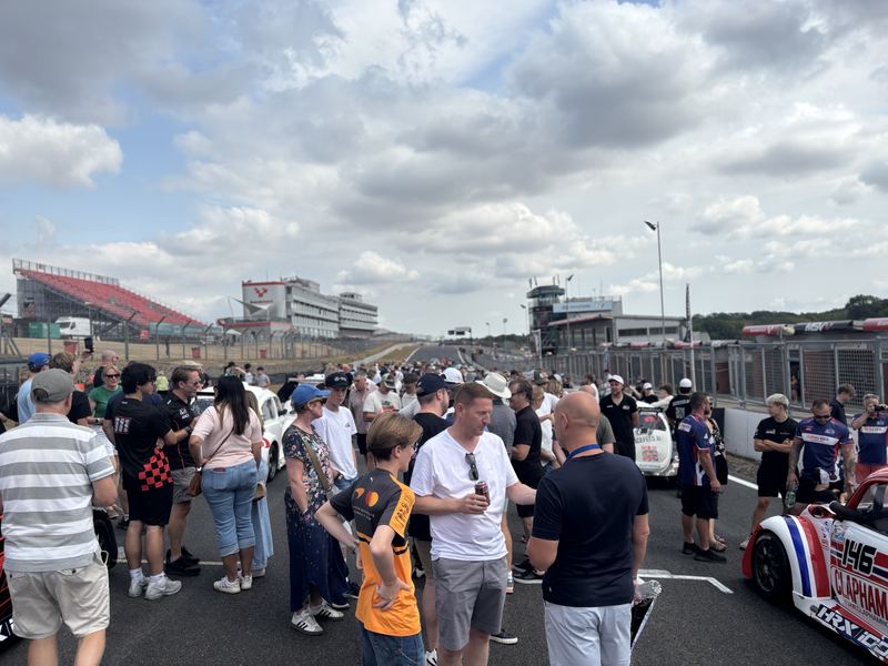 Guests and team members talking on the grid