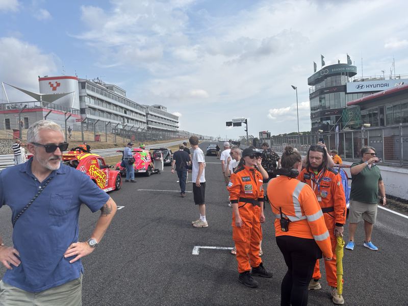 George Grant and marshals in orange on the grid at Brands Hatch