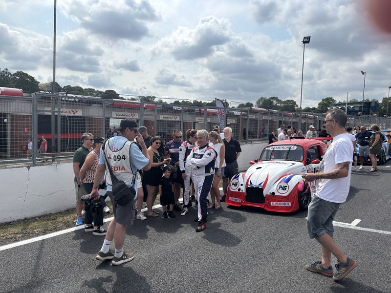 Guests gathering around Car 146 before the race